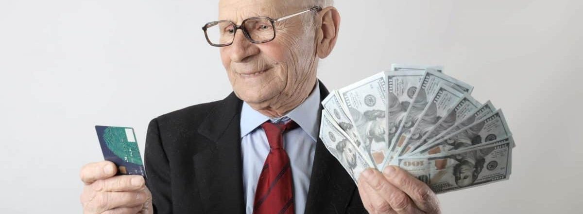 man in black suit holding banknotes and credit card 3831185 scaled e1584032363877 1 how to keep points from expiring