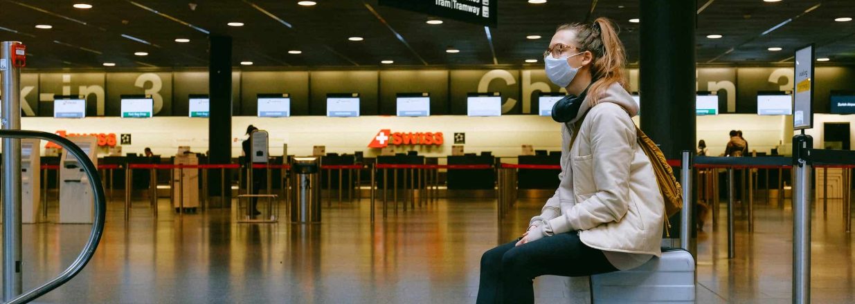 Woman wearing a mask at the airport