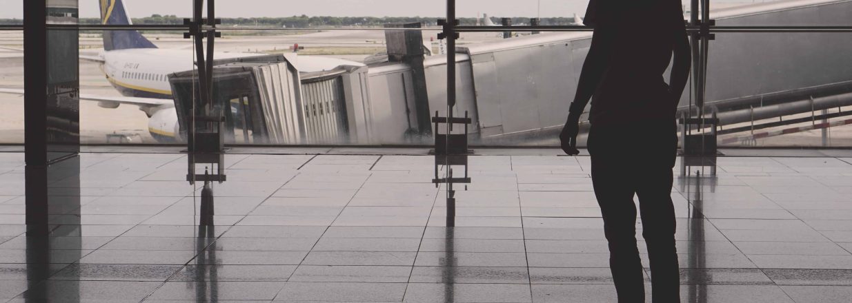 Canva Silhouette of Man Inside Concrete Building flights cancelled