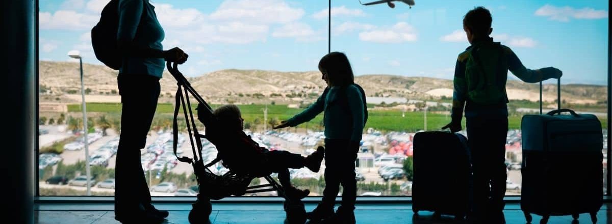 Family at an airport Singapore KrisFlyer Adds Family Pooling