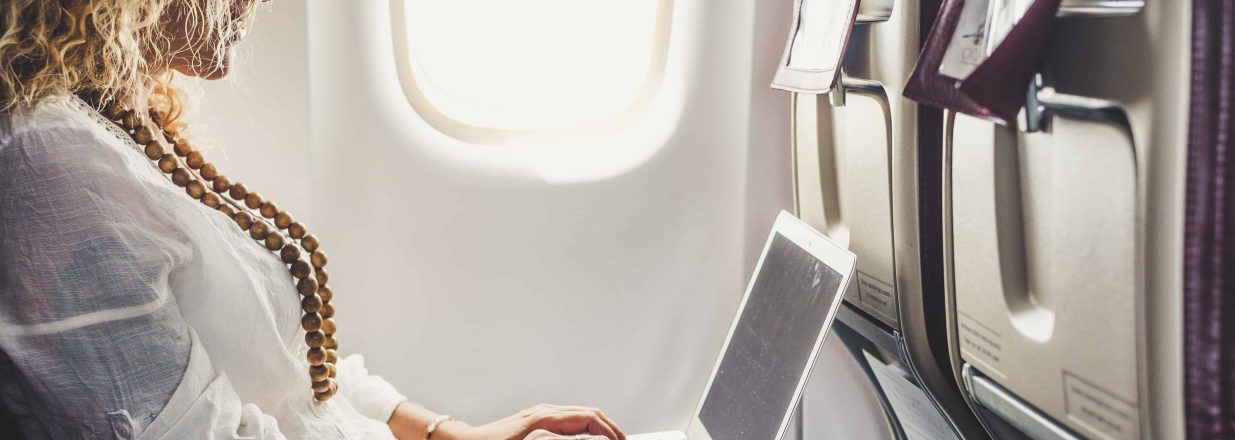 Woman using wifi united airlines wifi