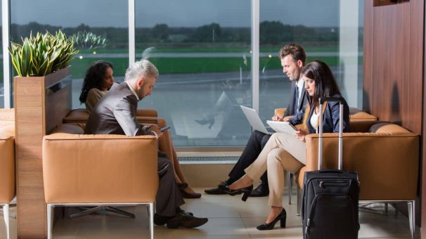 Travelers at an airport lounge american express lounge